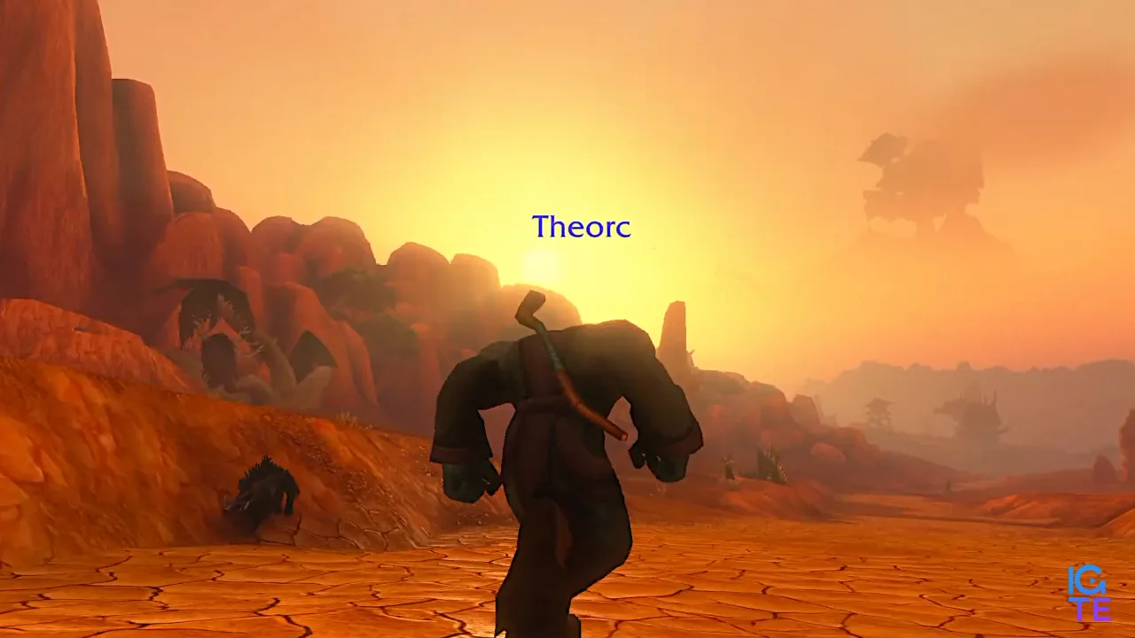 An orc running through a very pretty Durotar.